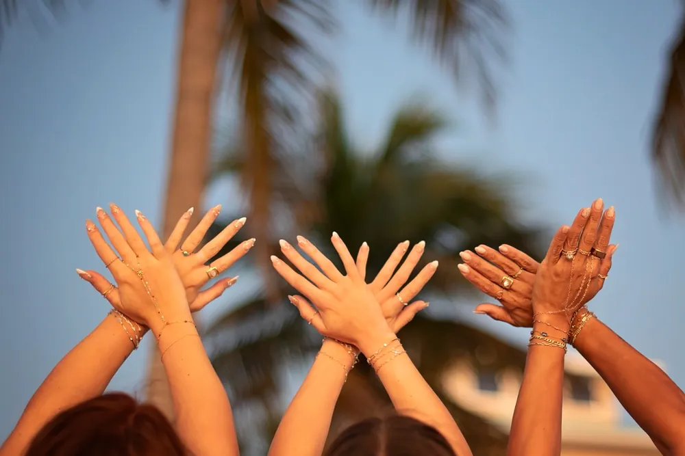 Hands decorated with permanent jewelry