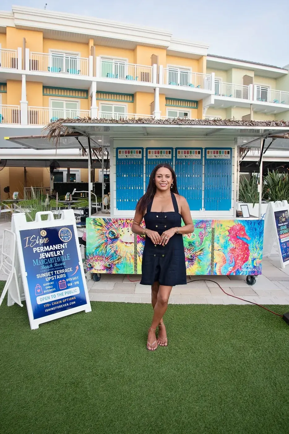 Emmy outside the I Shine Permanent Jewelry kiosk on the Sunset Terrace at Margaritaville Beach Resort Fort Myers Beach